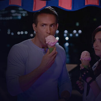 Medium shot of man and woman eating their cone ice cream