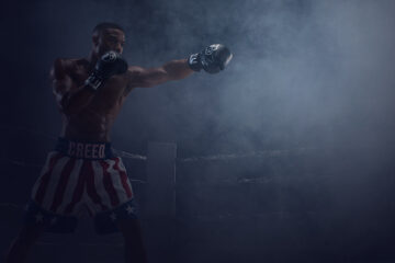 A boxer fighting in a ring