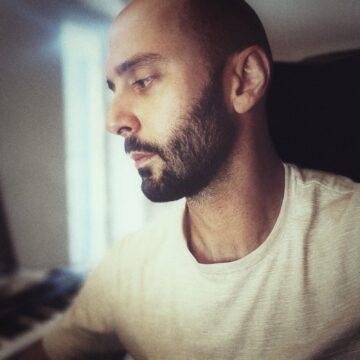 Close-up profile of the artist Frank Riggio