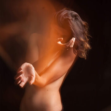 Medium shot of the artist Rïcïnn dancing and moving her arms