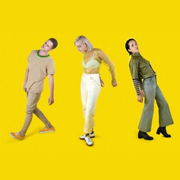 Long shot of the trio of composers FYOHNA, posing as if they were dancing