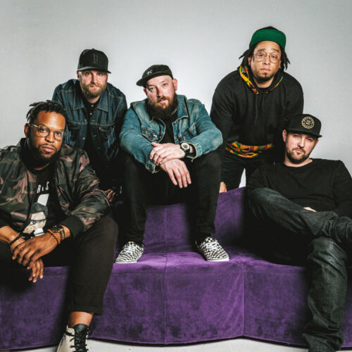 Four members of STL GLD sitting on a couch