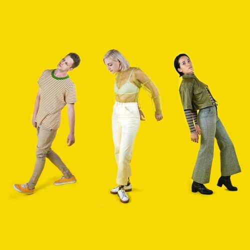 Long shot of the trio of composers FYOHNA, posing as if they were dancing